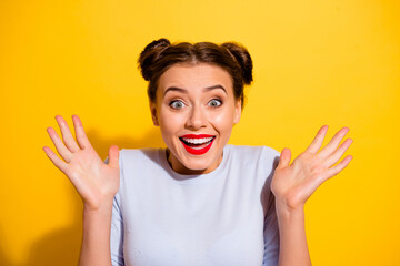 Photo of impressed crazy female win money in lottery giveaway become rich isolated on yellow color...