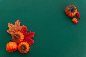 autumn collage on a green background with free space for your text autumn template invitation banner, maple leaves and pumpkins, autumnal leaves frame