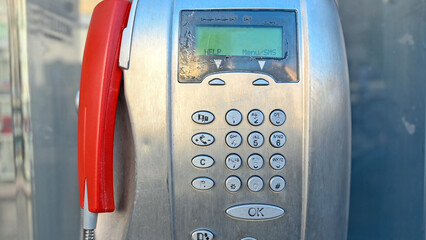 Old telephone booth dial numbers. Old Public phone booth on the street in the city. Keyboard with...