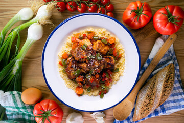 Marinated chicken with vegetables and couscous. Traditional African recipe.