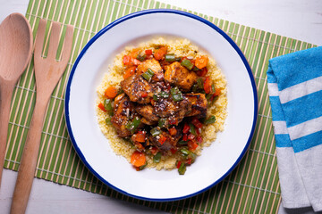 Marinated chicken with vegetables and couscous. Traditional African recipe.