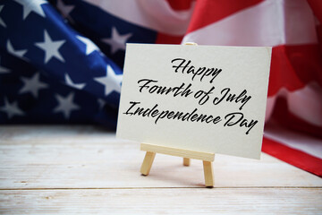 Happy Forth of July Independence Day text messege  with USA flag on wooden background