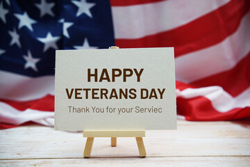 Happy Veterans Day  text messege  with USA flag on wooden background