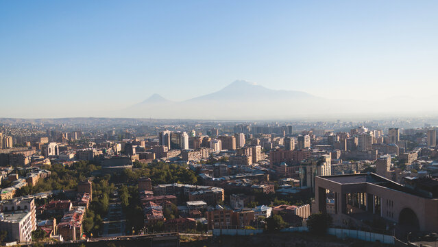 Yerevan, Armenia, beautiful super-wide angle panoramic view of Yerevan with Mount Ararat, cascade complex, mountains and scenery beyond the city, summer sunny day