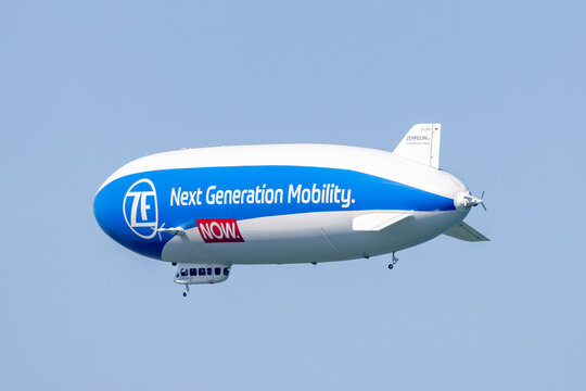 Bodensee, Germany - July 18, 2022: Side and rear view of the ZF zeppelin flying over the Bodensee in Germany and Austria. 