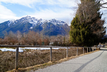 Alpine village Garmisch-Partenkirchen or Garmisch with the snowy Alps in the background in Bavaria on a cold day in March (Germany)