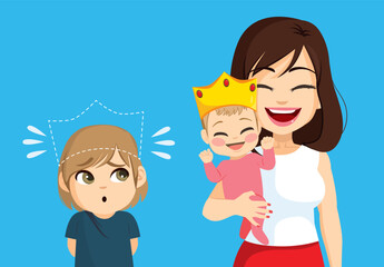 Cute little son boy feeling bad dethroned by new baby on family. Unhappy kid jealousy concept