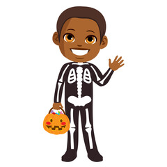Cute little boy wearing skeleton costume and holding Trick or treat pumpkin basket for Halloween party