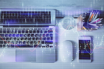 Multi exposure of forex graph drawing over desktop background with computer. Concept of financial analysis. Top view.