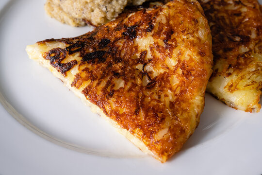 Frico Friulano Italian Montasio Cheese and Potato Rosti with Polenta a Traditional Dish from the Friaul Region of Italy