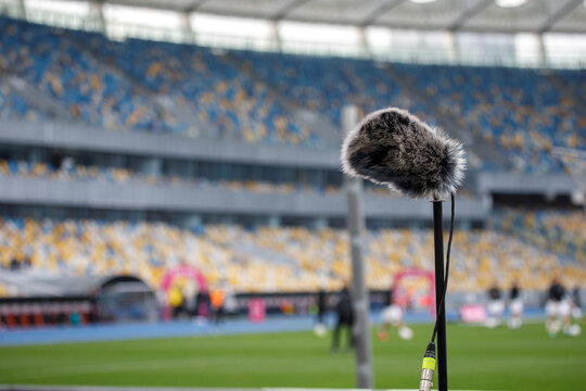 Directional microphone on the football field to record the sound of the match