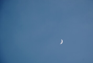 half moon on blue sky in evening