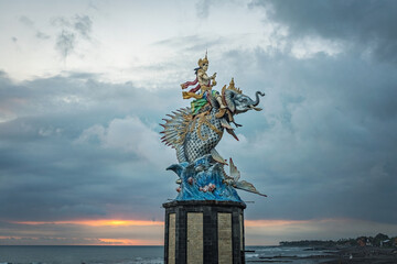 God Baruna statue in Pererenan beach at sunset, Bali, Indonesia