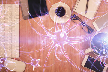 Double exposure of neuron drawing over table with phone. Top view. Science education concept.