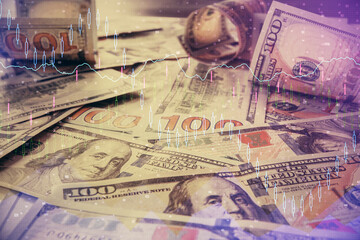 Multi exposure of forex chart drawing over us dollars bill background. Concept of financial success markets.