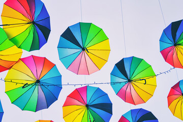 Colorful umbrellas on the sky background.	