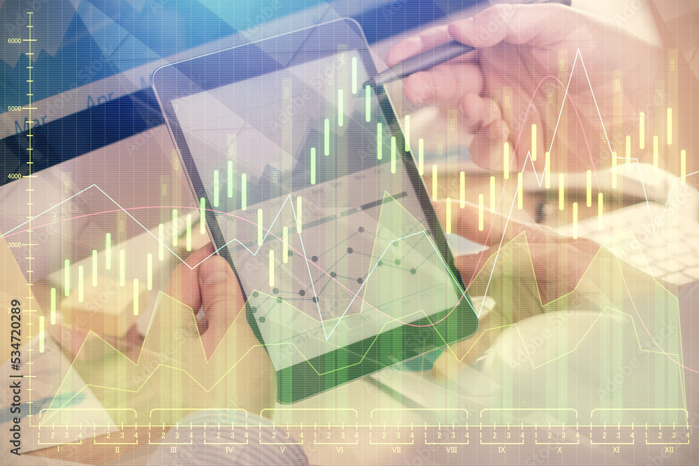 Poster double exposure of man's hands holding and using a phone and financial chart drawing. market analysi