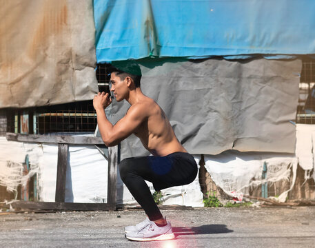 Young man with fit and firm muscle squart for strong hip