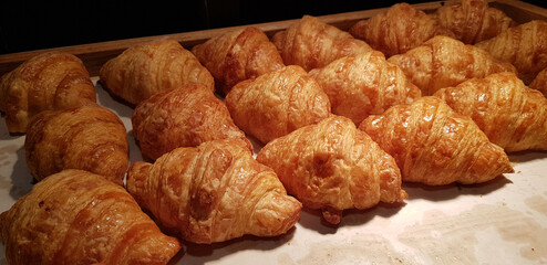 Fresh Baked Croissants. Warm Fresh Buttery Croissants and Rolls. French and American Croissants and Baked Pastries
