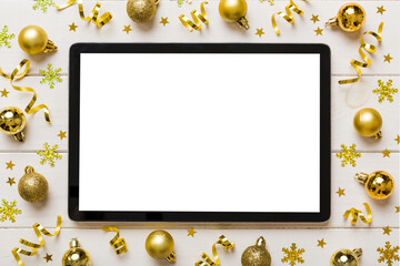 Christmas online shopping from home tablet pc with blank white display top view. Tablet with copy...