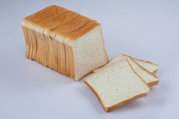 whole wheat bread slices on a white background