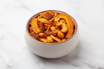 Close-up of  Shahi vrat or upvas or Fasting namkeen Mixture made from coconut,ground nuts, cashew, potato slice, peanut, Indian spicy snacks (Namkeen), 