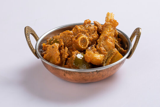Achari mutton curry isolated on white background