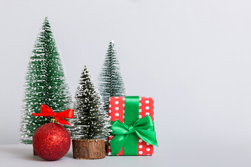 Christmas composition. craft Gift box, small tree, branches and craft DIY decorations on white background. New year concept. Christmas home decoration Flat lay, top view, copy space