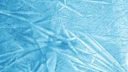 Abstract ice texture. A network of cracks on a piece of blue ice