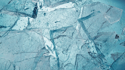 Abstract ice texture. A network of cracks on a piece of blue ice