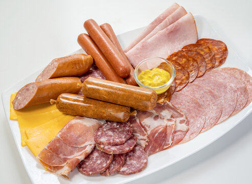 Assorted cold cuts, sausages and cheese on plate