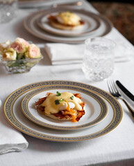 Eggs benedict at breakfast table