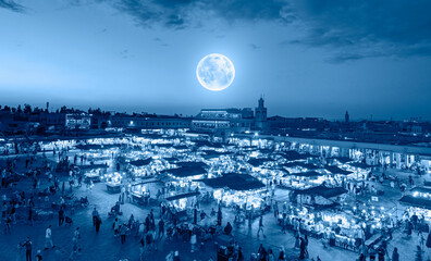 The Jema el Fna square in Marrakesh, Morocco with full moon 