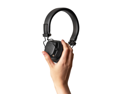 Black headphones in hand isolated on white