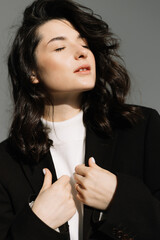 Fashion photo of young magnificent woman on white background. Girl posing. Studio photo.