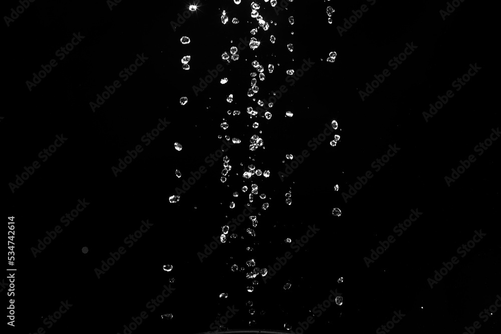 Poster water splashes isolated on black background. white jets with drops
