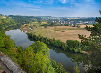 Fototapeta na wymiar View of the river Neckar from the red tower (imperial palace) in Bad Wimpfen. Neckartal, Baden-Wuerttemberg, Germany, Europe