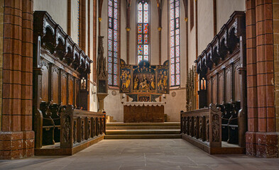 Interior view of the evangelical town church of Bad Wimpfen, view of choir stalls and altar....