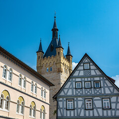 Franconian half-timbered buildings with the Blue Tower (built in 1200) of Bad Wimpfen. Neckartal,...