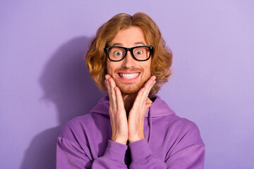 Photo of cute wavy red hairstyle guy wear eyewear purple hoodie isolated on pastel violet color...