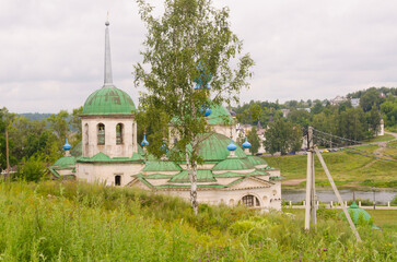 The ancient church of the Nativity of the Blessed Virgin Mary (Paraskeva Friday on the market square) on the early July morning. Staritsa, Tver region, Russia