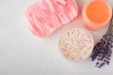 Natural lavender scrub on a white texture background.Body scrub. Body care. Sugar peeling scrub with argan oil and Himalayan salt. spa set