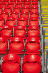Colourful pattern formed by a section of furniture in an English sports stadium 