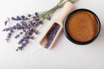 Natural lavender scrub on a white texture background.Body scrub. Body care. Sugar peeling scrub with argan oil and Himalayan salt. spa set