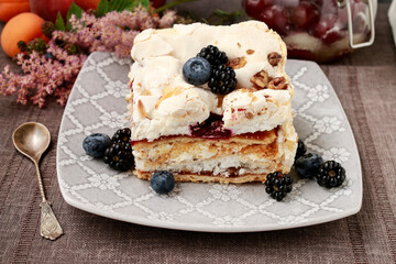 Layer fruit cake with meringue topping.