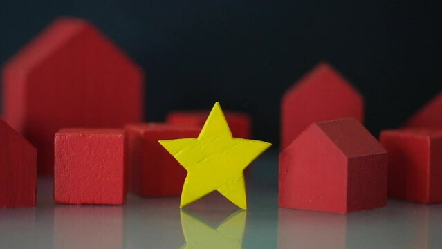 Give wood yellow star to red home. The concept of estimating and rate a house