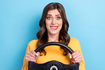 Photo portrait of pretty young woman hold steering driving test nervous dressed stylish yellow...