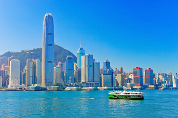 Fototapeta premium View of Victoria Harbor and Hong Kong skyline on a sunny day.