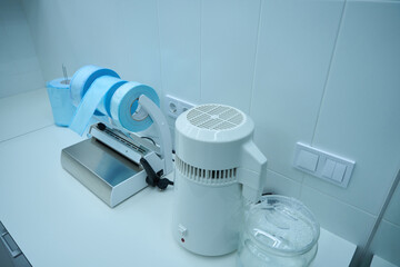 Fototapeta na wymiar Close up photo of stomatological instrument standing on table
