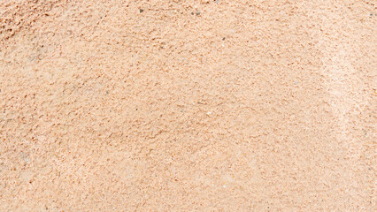 Backgorund and textured of finely compacted sand surface.